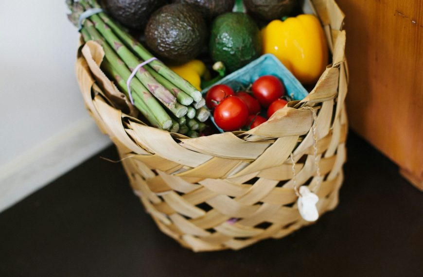 bunch of assorted produce in brown wicker basket