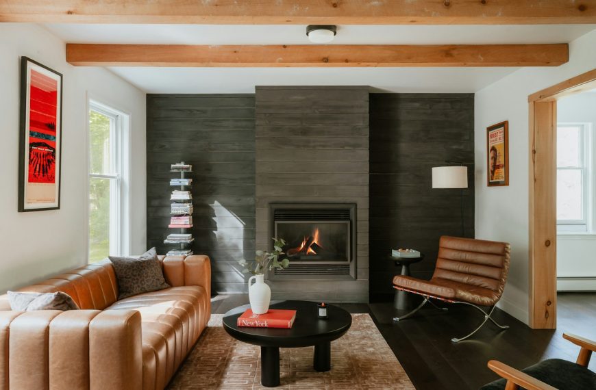 Modern living room with leather sofa and fireplace