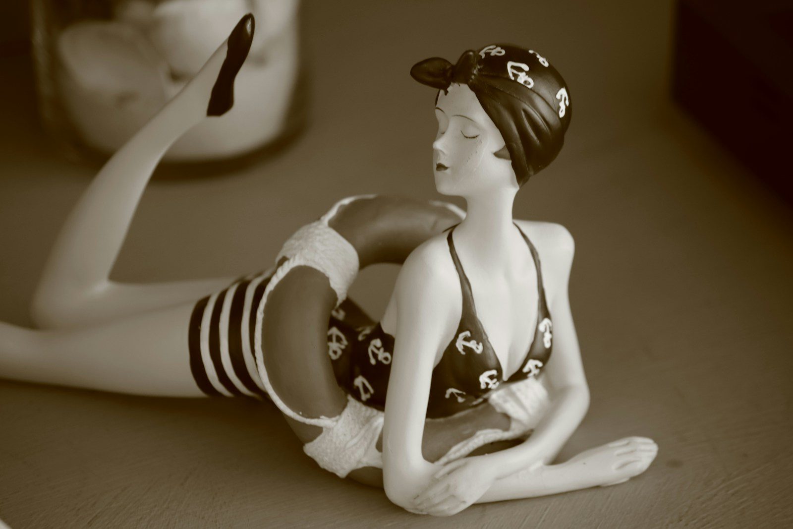 Vintage figurine of woman in swimsuit with life preserver
