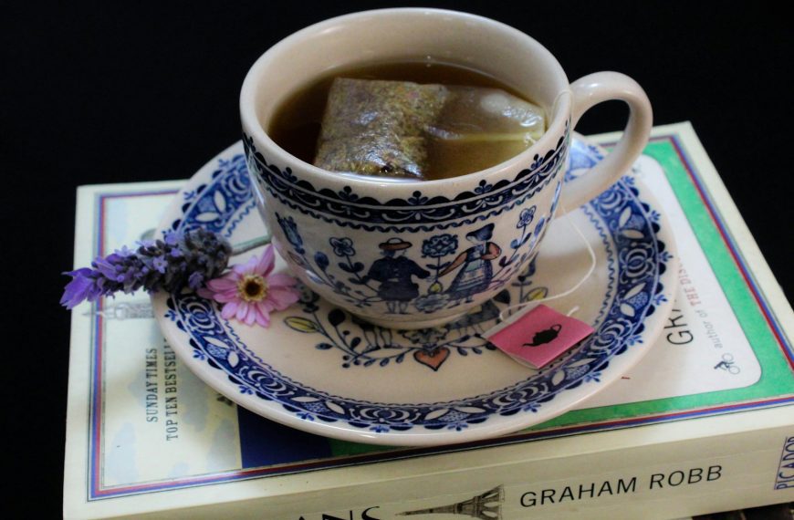 a cup of coffee on a book