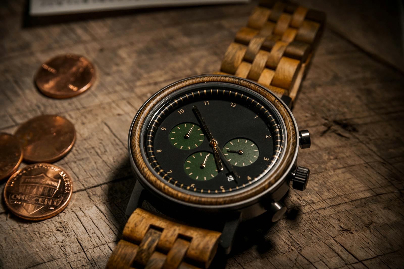 Close-up of a stylish wooden wristwatch on a rustic wooden table with coins.