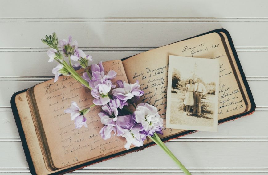 purple flowers on brown open book