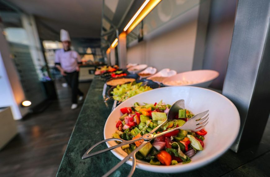 A colorful salad on a buffet table in a restaurant, emphasizing freshness and variety.