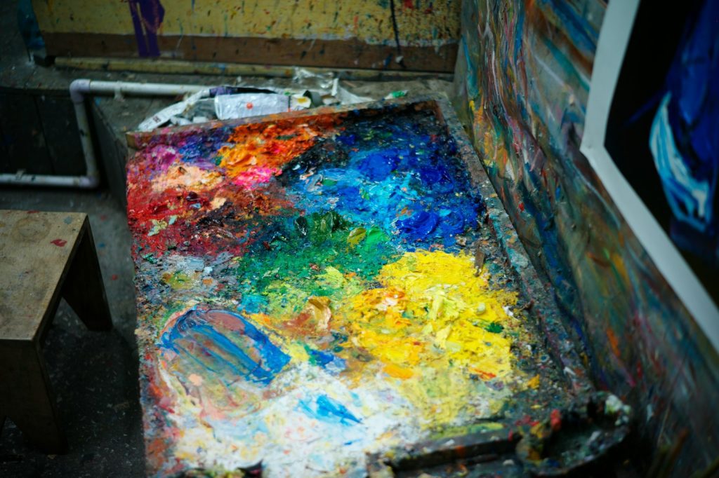 a painting is being displayed in an art studio