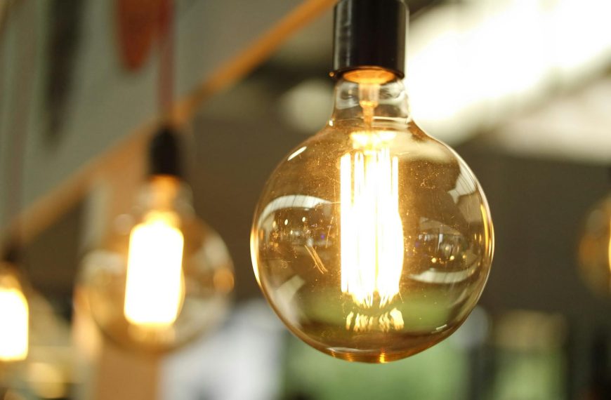 A close-up of a glowing vintage Edison bulb creating a warm atmosphere.