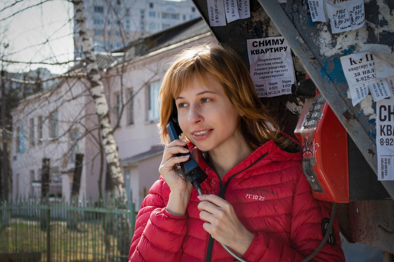 woman, call, phone booth, payphone, landline telephone, street, city, road, winter, communication