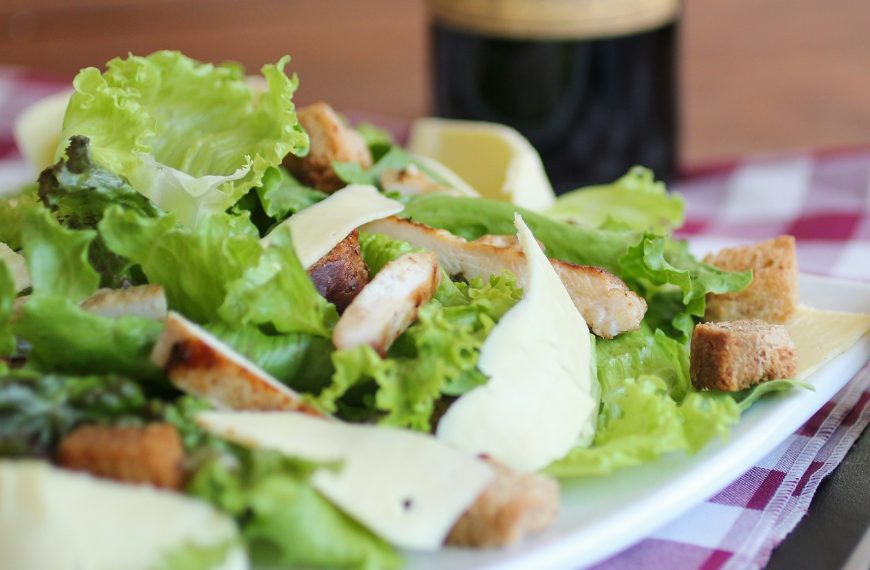 meat with lettuce on white ceramic plate