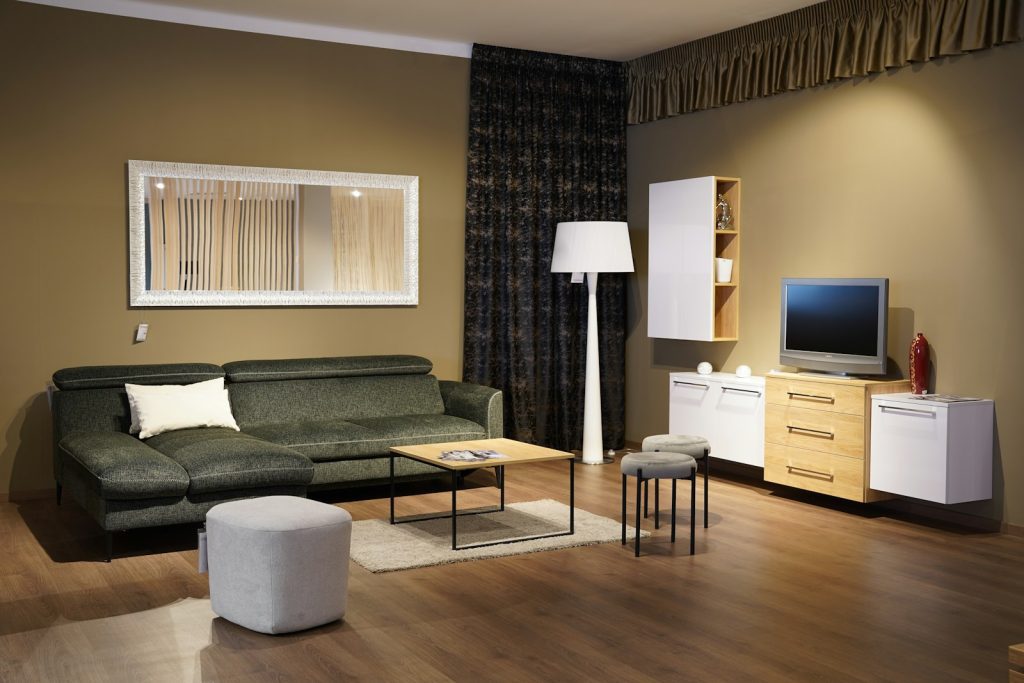 a living room filled with furniture and a flat screen tv