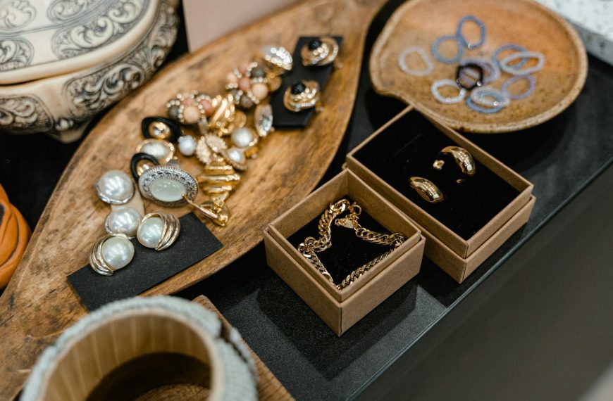 A sophisticated display of assorted jewelry pieces arranged on elegant wooden trays.