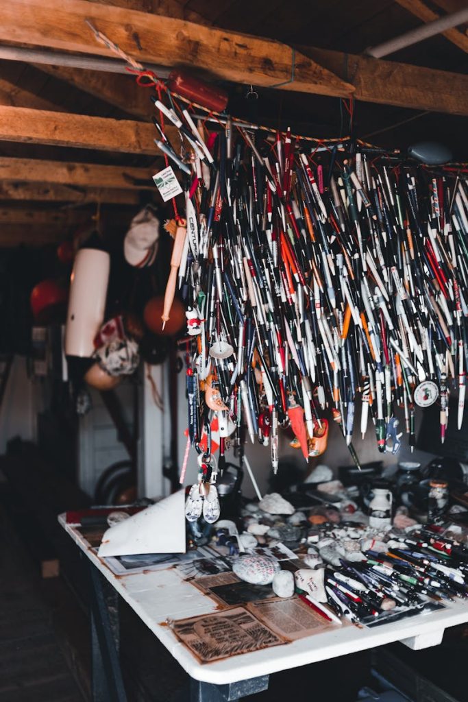 Unique indoor market setup featuring an array of hanging souvenirs and collectibles.