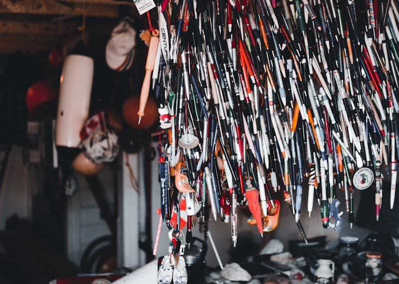 Unique indoor market setup featuring an array of hanging souvenirs and collectibles.