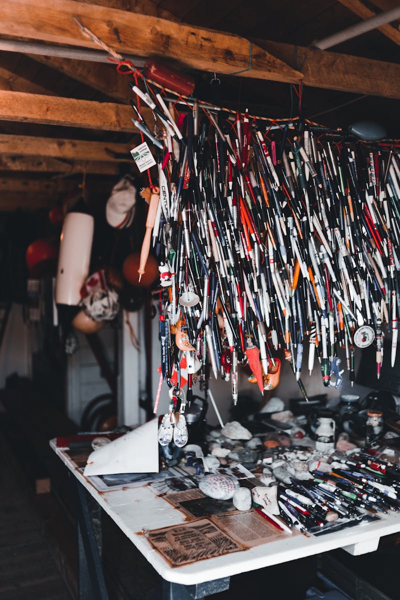 Unique indoor market setup featuring an array of hanging souvenirs and collectibles.