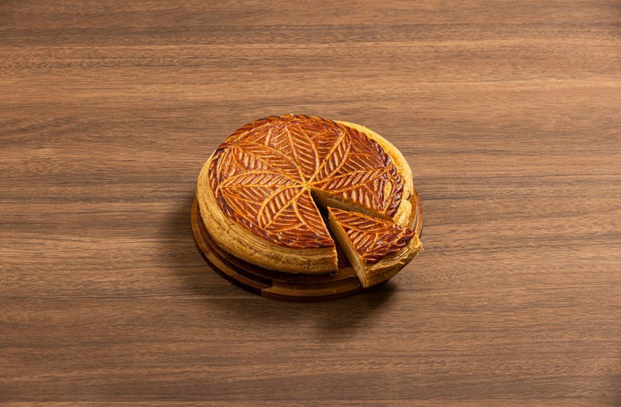 A close up of a cake on a wooden table