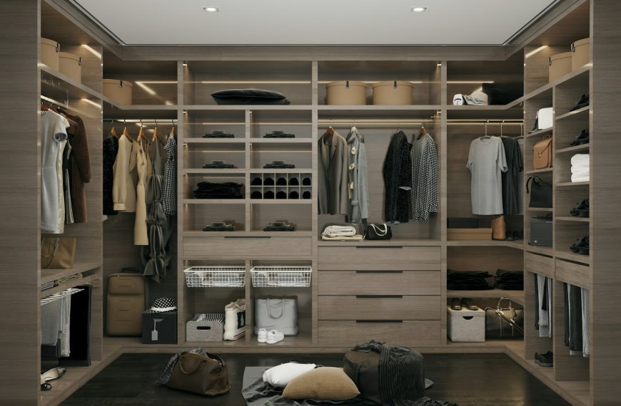 a walk in closet filled with lots of clothes