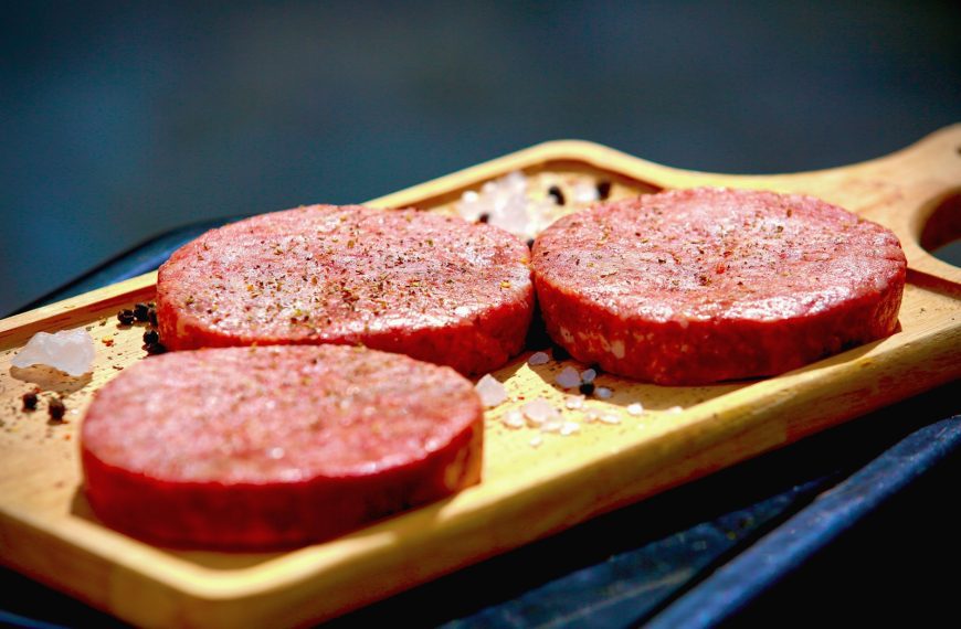 brown bread with red sauce on brown wooden tray