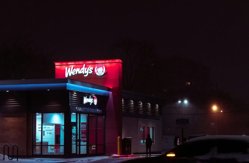 red and white concrete building during nighttime