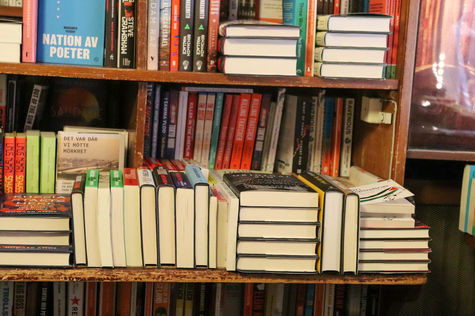 Bookshelves are packed with many, many books.