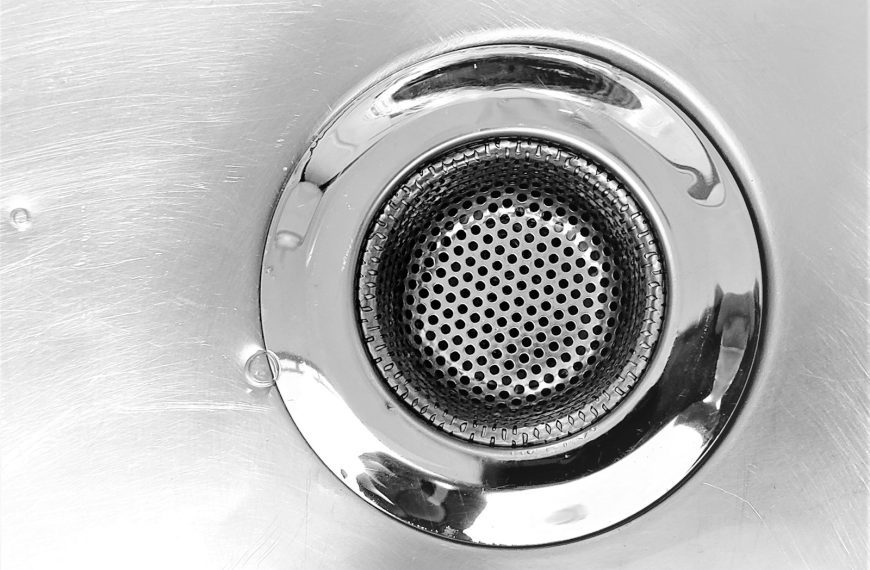 a close up of a metal sink drain