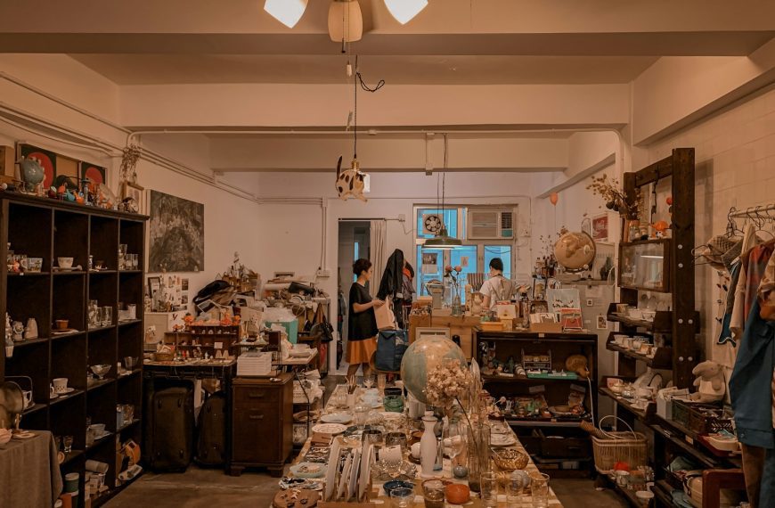 woman in black jacket standing in front of kitchen counter
