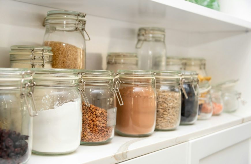 a row of jars filled with different types of food
