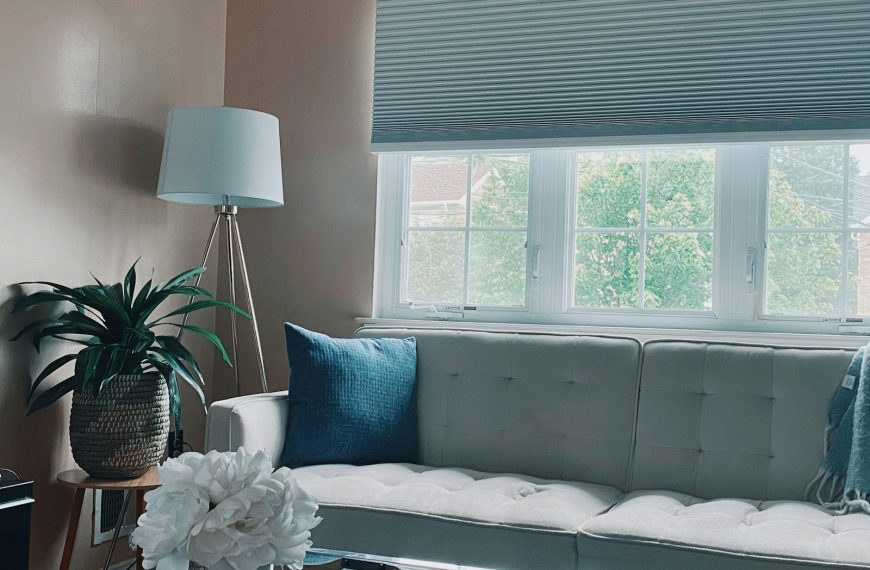 white and black bed near window