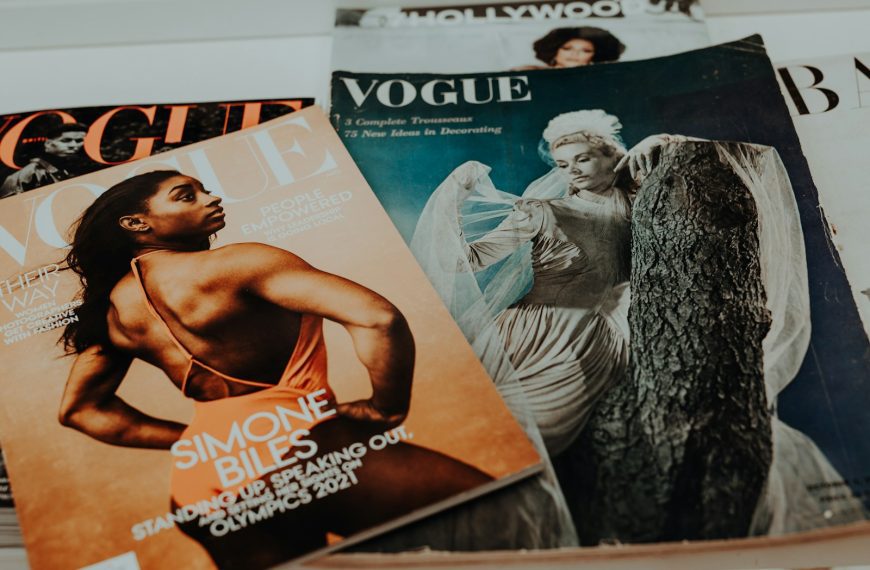 a pile of magazines sitting on top of a table