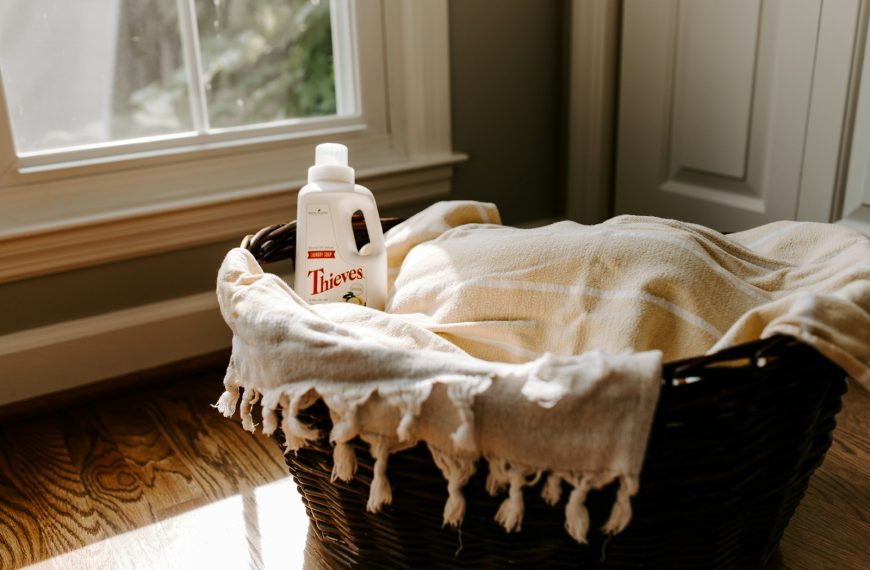 a bottle of deodorant sitting on top of a blanket