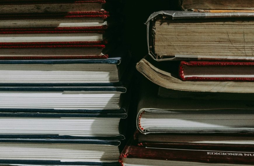 stack of books on black surface