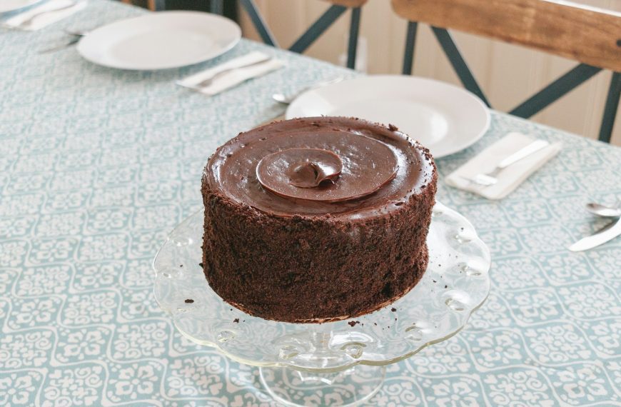 chocolate cake on white table cloth