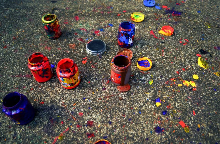 a group of paint cans sitting on top of a floor