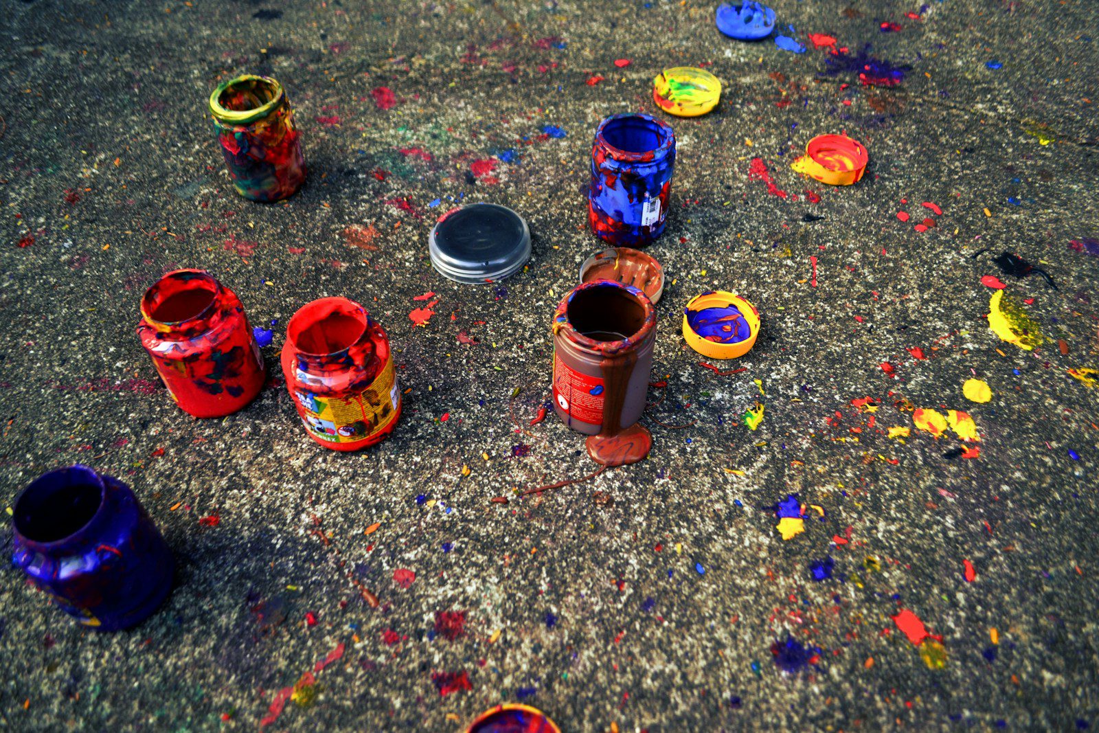a group of paint cans sitting on top of a floor