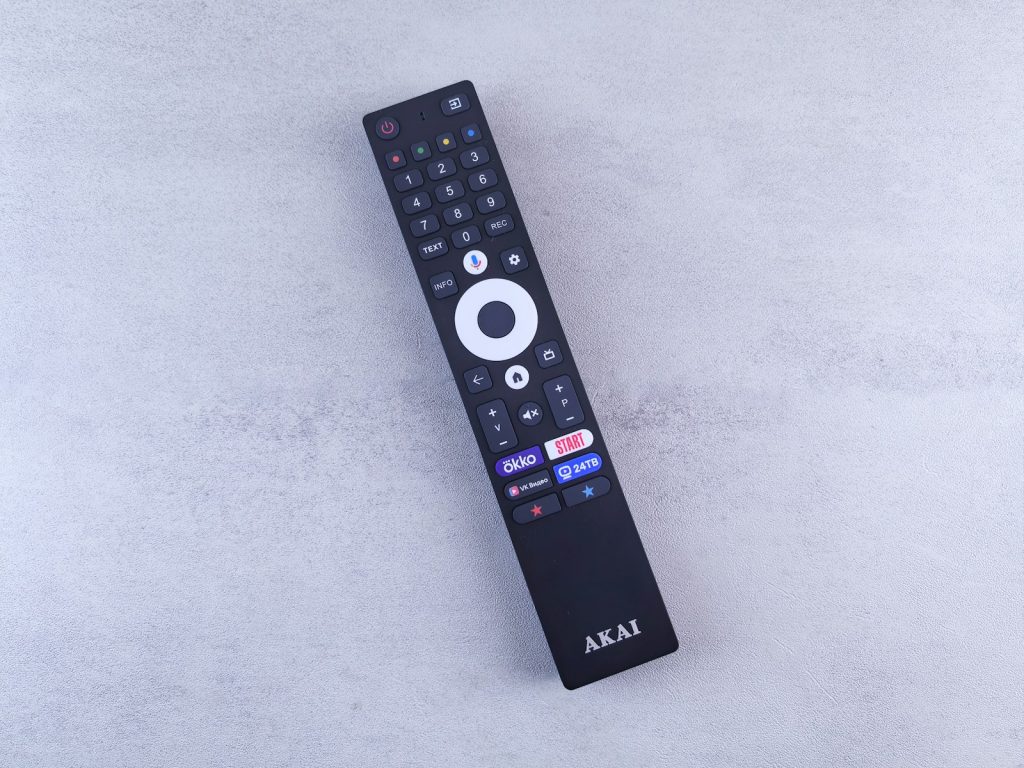 A close up of a remote control on a white surface