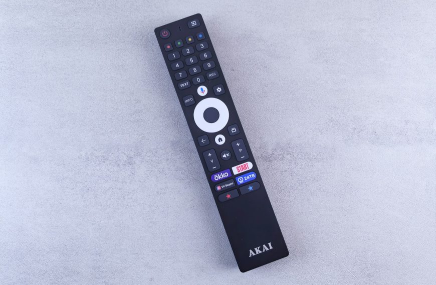 A close up of a remote control on a white surface