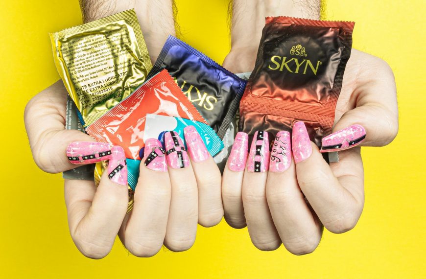 a person holding three different types of candy in their hands