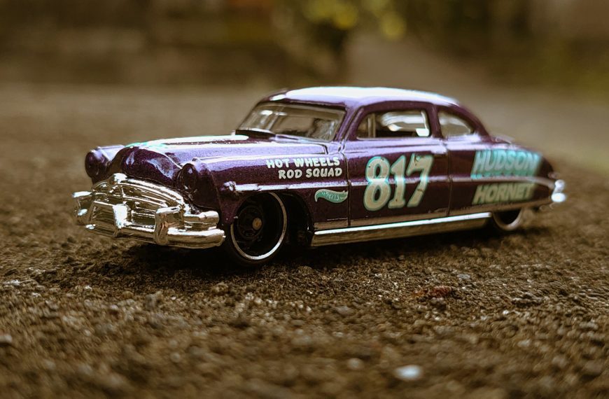 a car driving on a dirt road