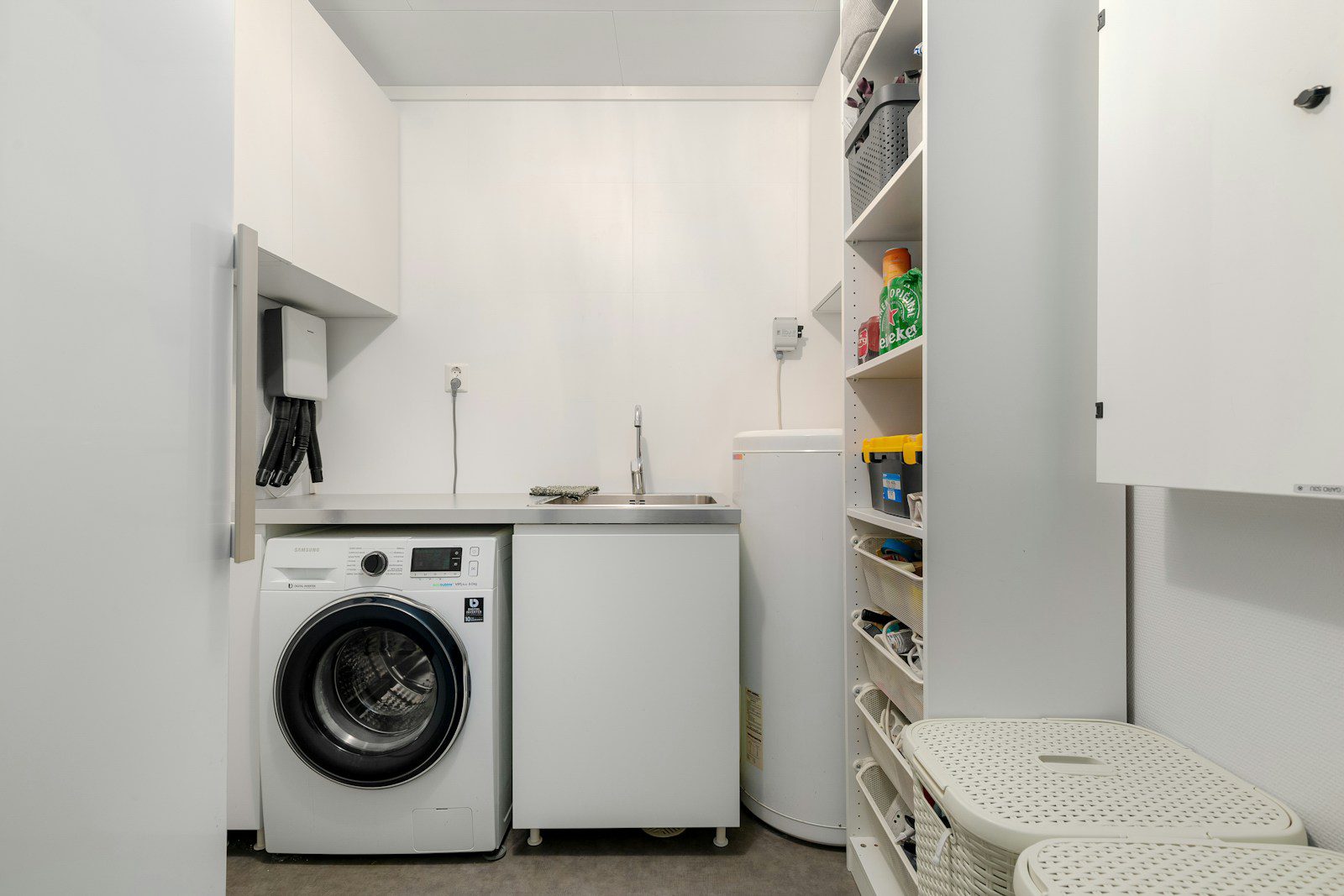 A laundry room with a washer and dryer