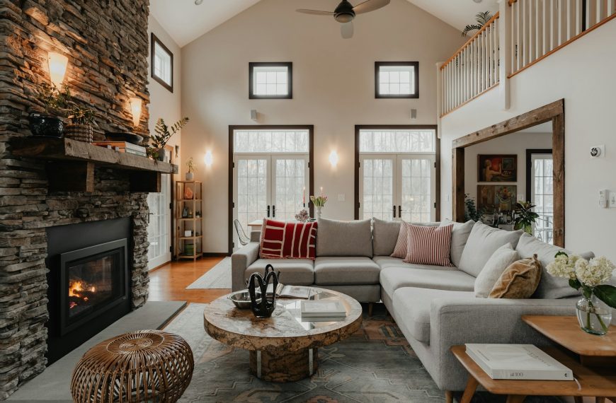 a living room filled with furniture and a fire place