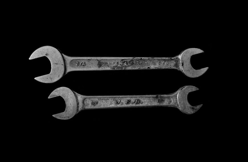 two silver open wrenches
