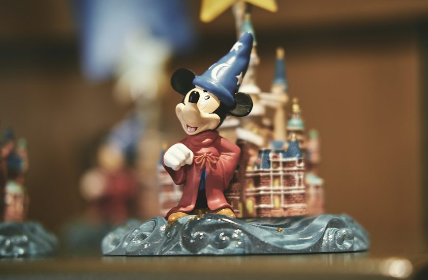 mickey mouse figurine on blue table