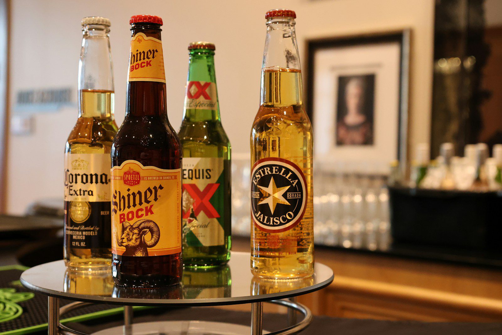 A bunch of beer bottles sitting on a table