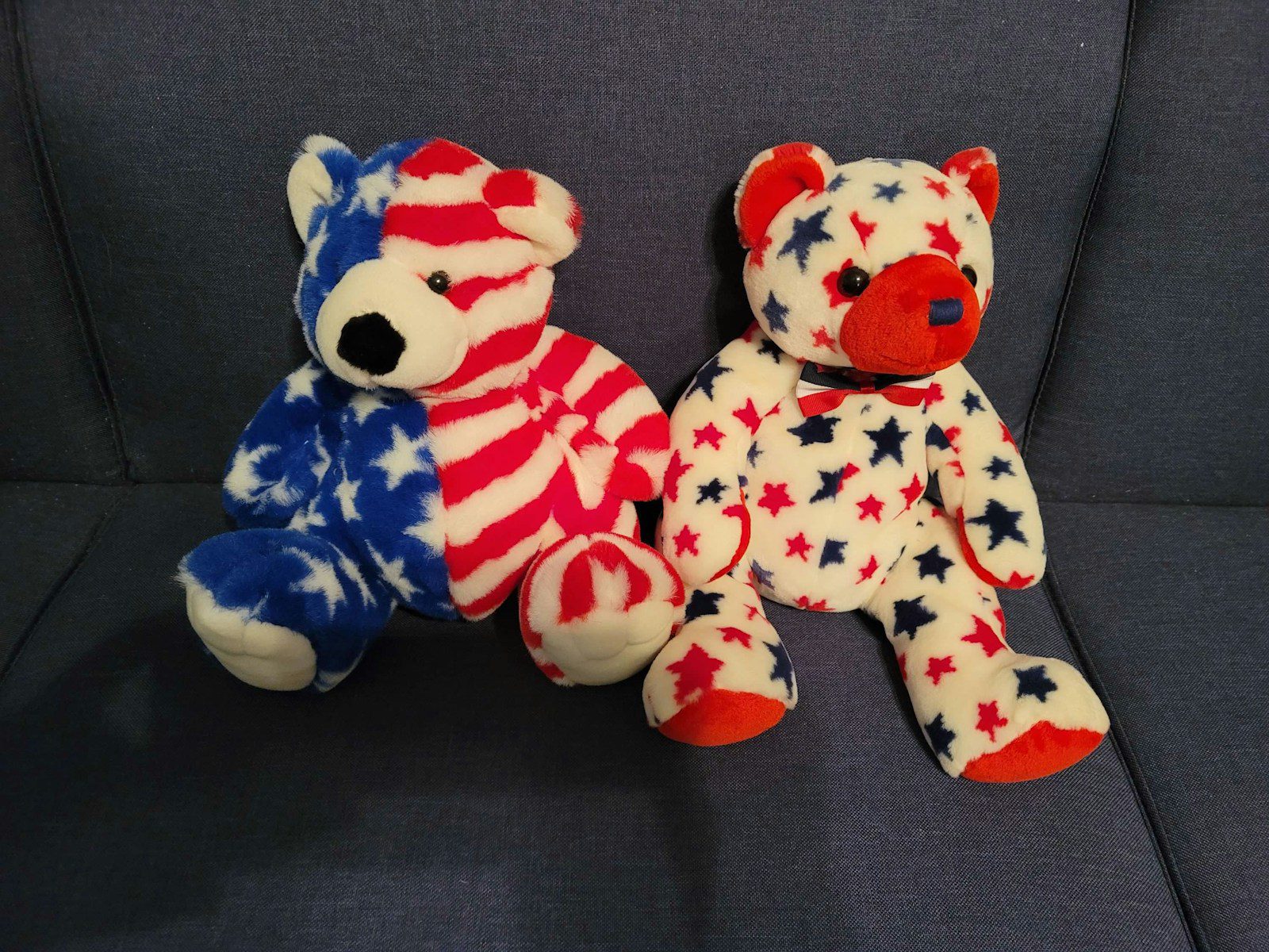 a couple of stuffed animals sitting on top of a couch