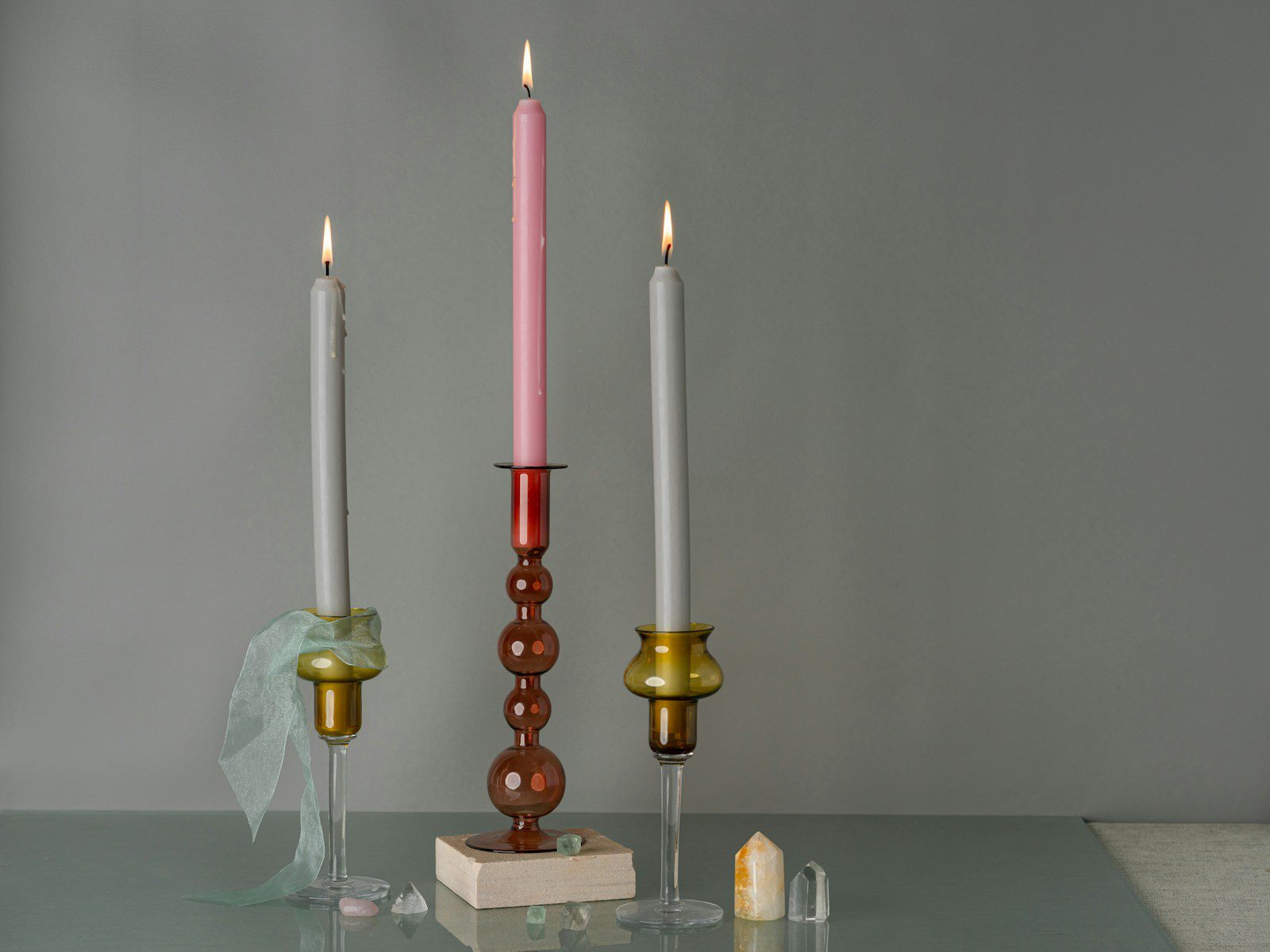 A couple of candles sitting on top of a table