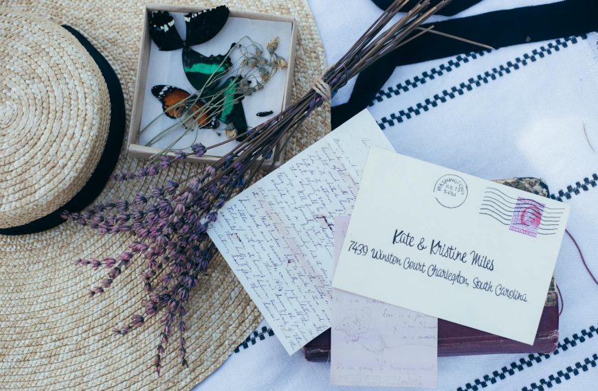 Nostalgic composition featuring lavender, a straw hat, and handwritten letters.