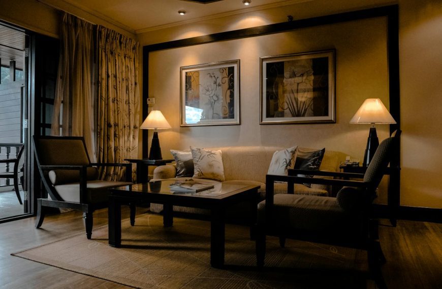 Stylish and cozy living room featuring elegant furniture and warm lighting.