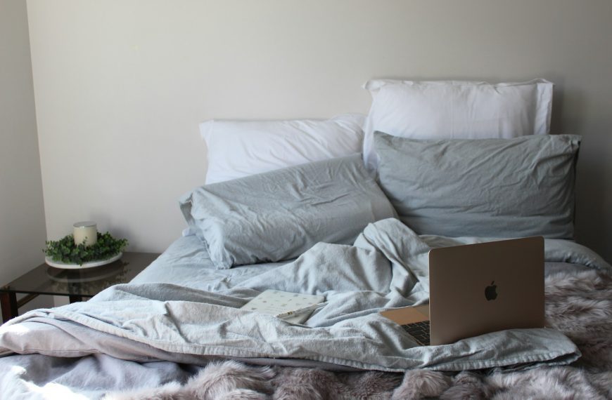 white pillow on white bed