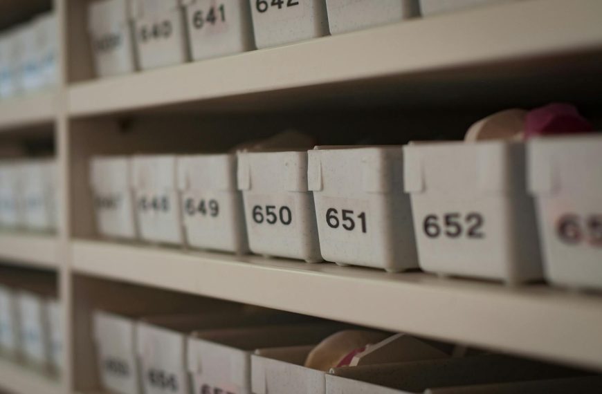 Close-up of numbered storage containers on shelves in an organized setting.