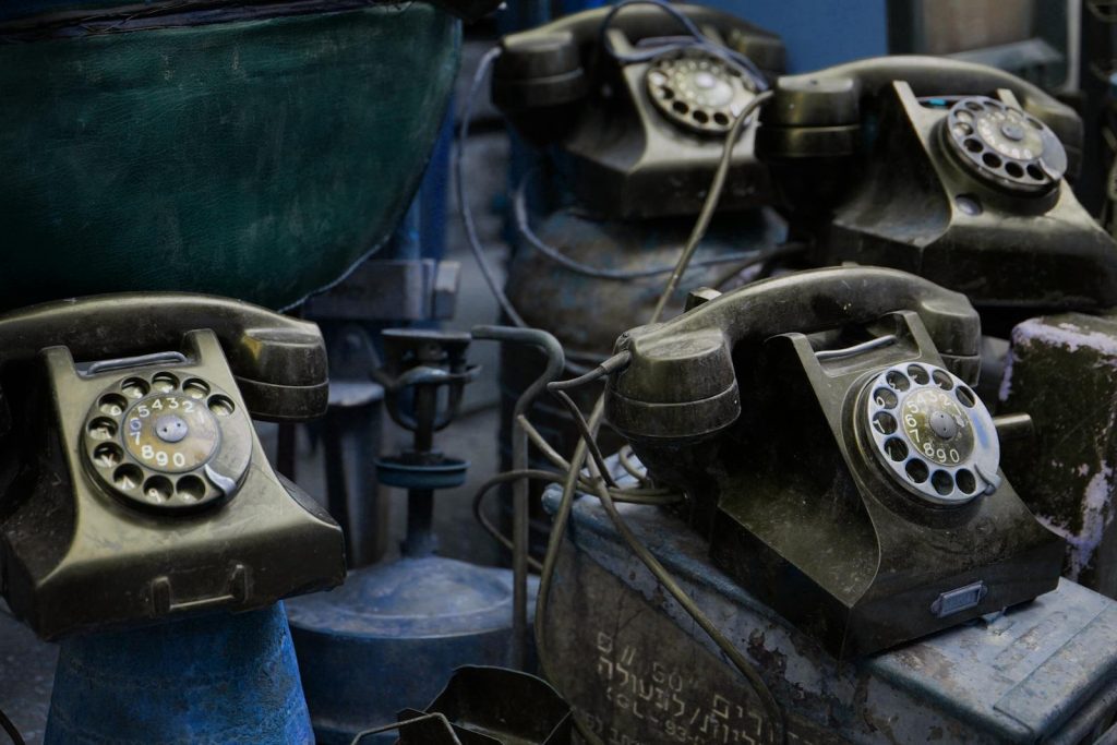 Close-up of vintage rotary telephones with a nostalgic feel, captured indoors.