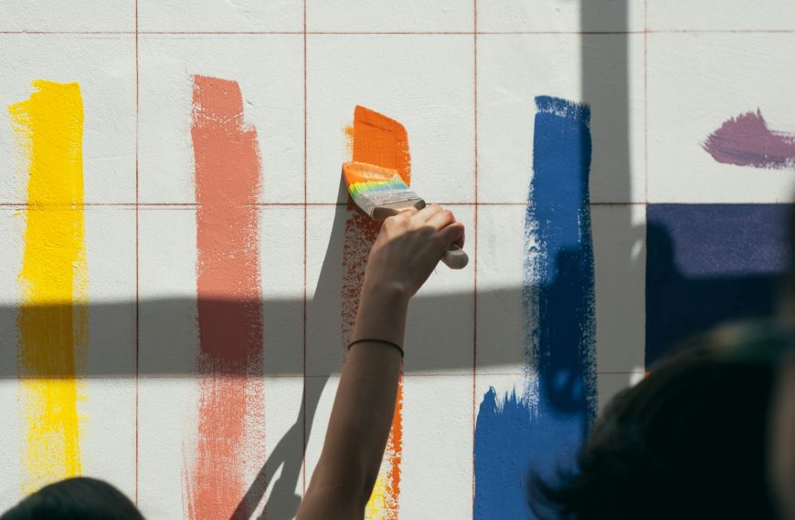 person painting wall