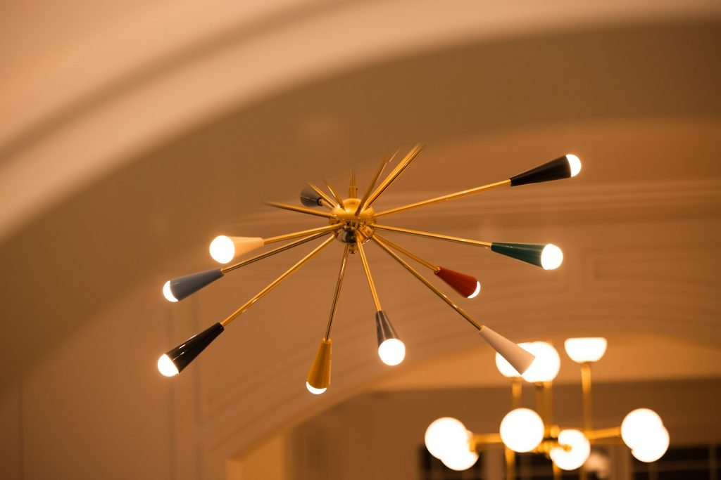 A starburst chandelier with colorful accents.
