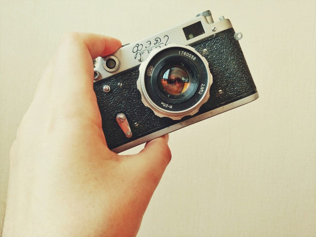 silver and black point and shoot camera